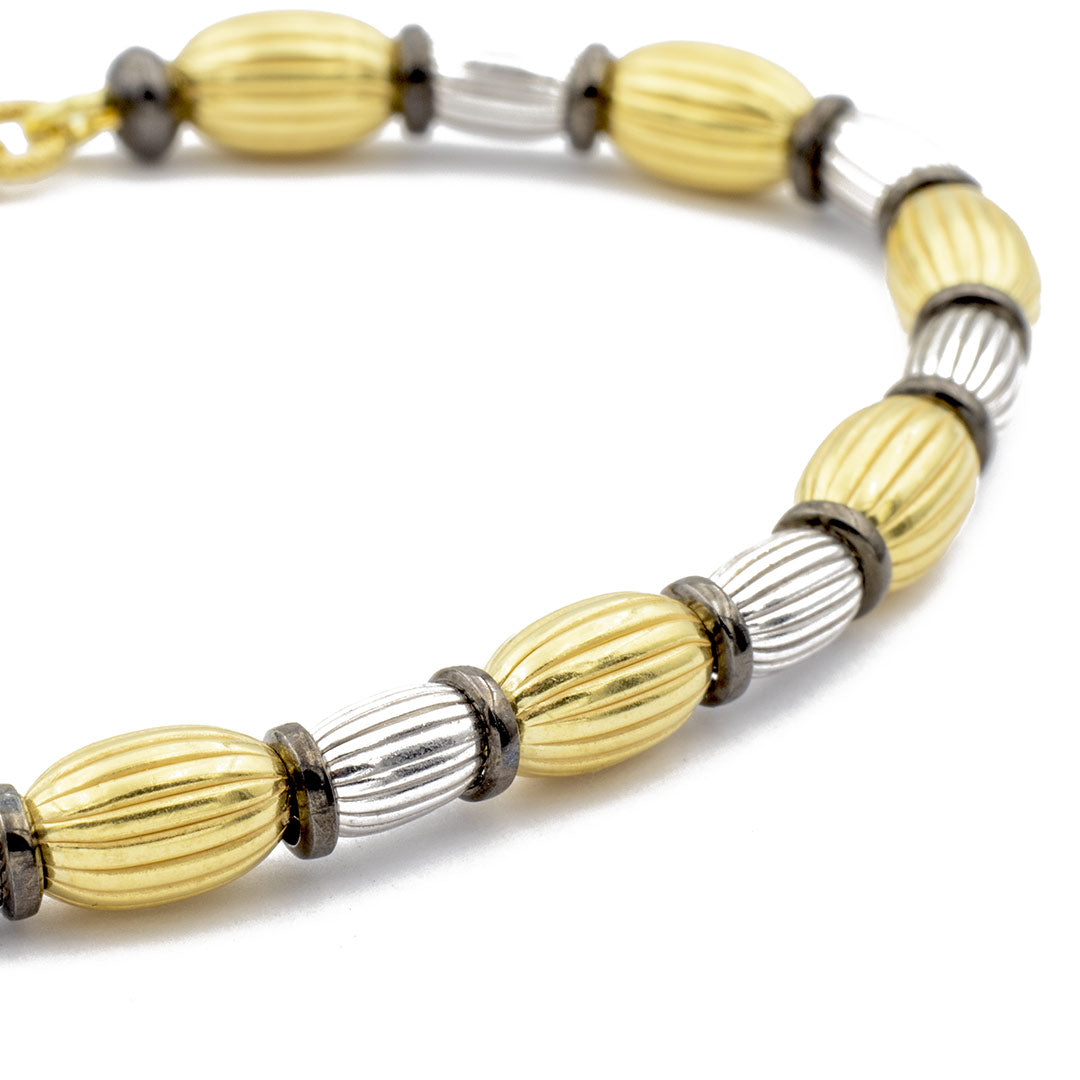 elementi ovali rigati dorati e rodiati del bracciale in argento - via condotti store