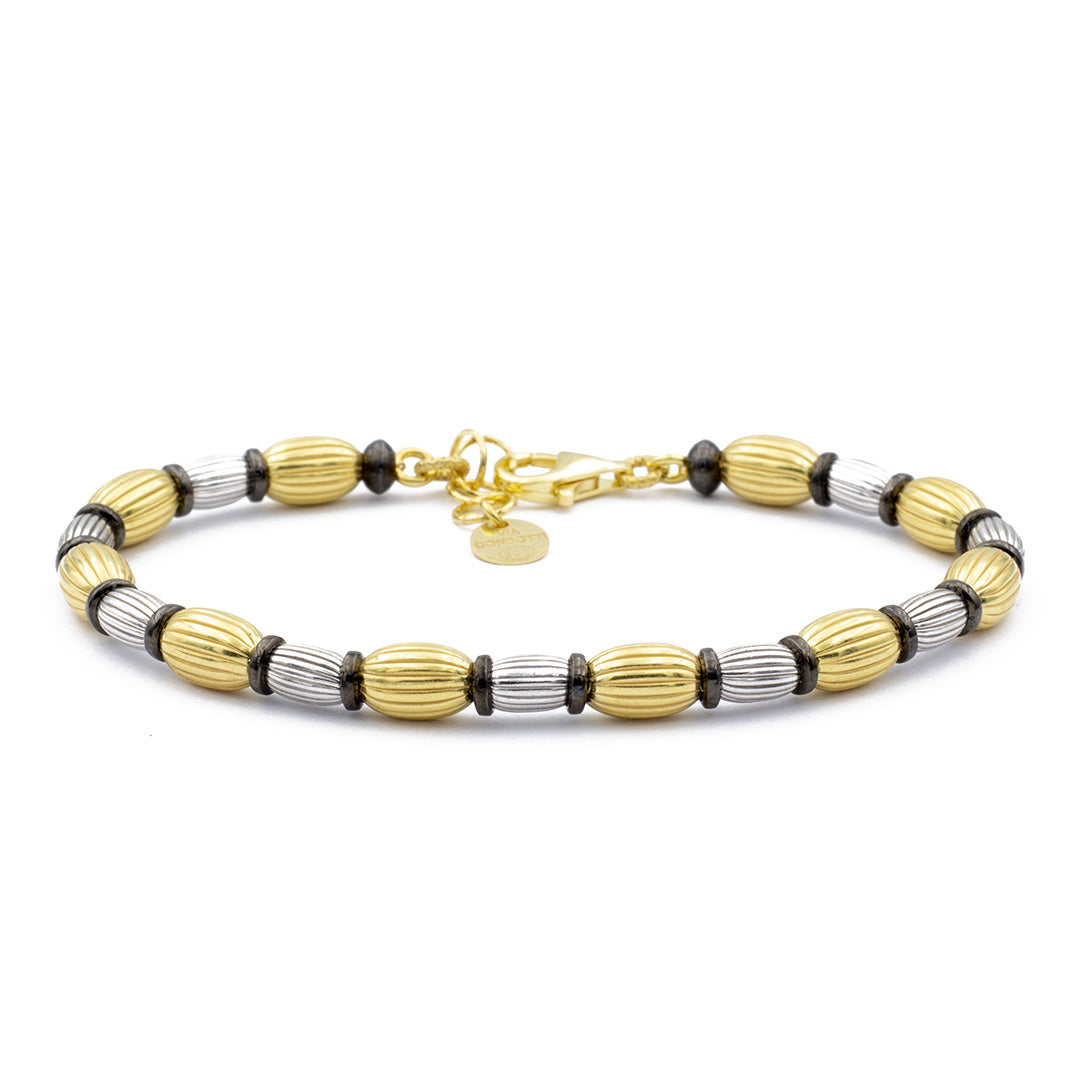bracciale da donna in argento con elementi ovali rigati dorato e rodiato - via condotti store