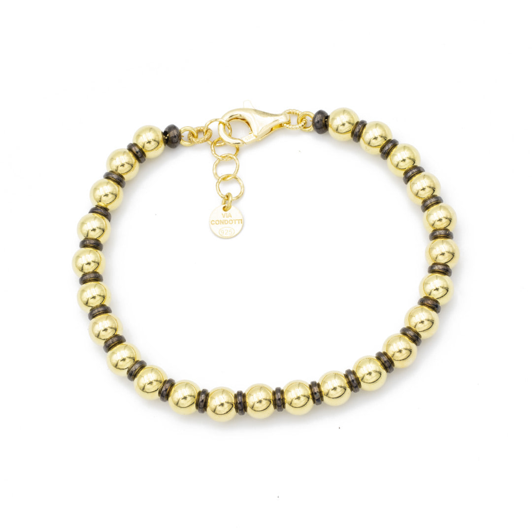 bracciale con sfere in argento placcato oro giallo e inserti in rutenio nero - via condotti store