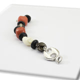 Bracciale in argento con corallo, lava e madreperla - via condotti store